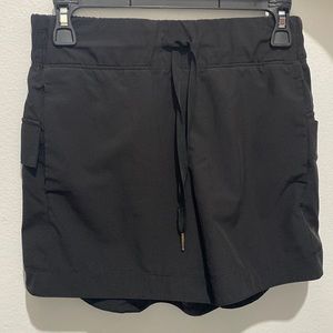 Black Apana shorts, size 8